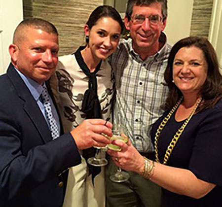 Jessica celebrates with clients and contractors on completion of Finney's Wharf